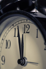 Fototapeta na wymiar Black, vintage alarm clock with qwhite background