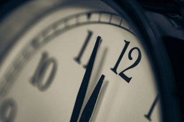 Black, vintage alarm clock with qwhite background