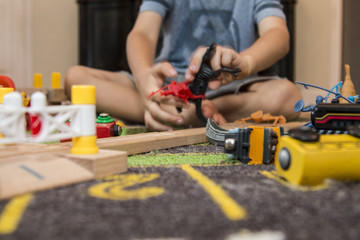 Boy playing at home with toys