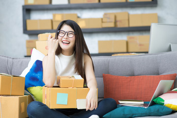 Portrait cute asian woman entrepreneur, teenager business owner work at home, many stuff to do...
