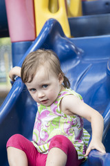 Fototapeta na wymiar Girl playing at playground