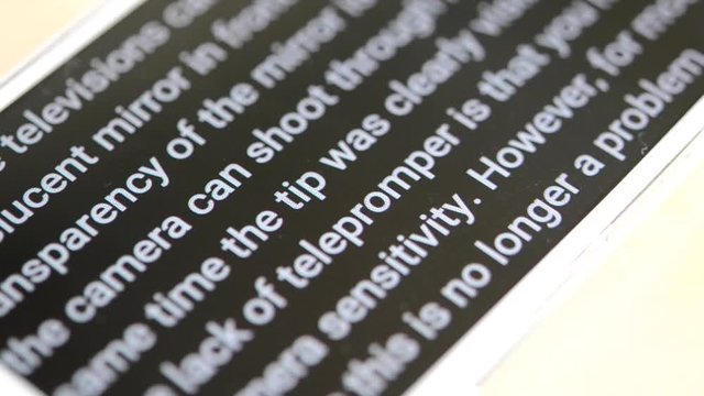 Teleprompter automatically scrolls text close-up.