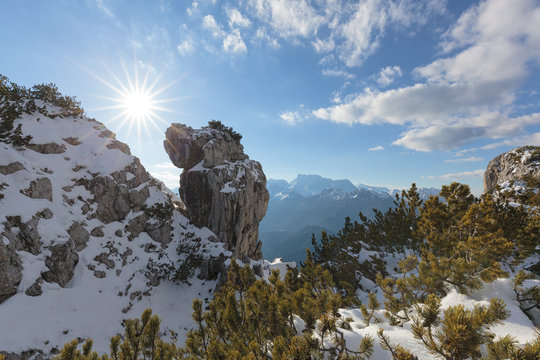 Europe, Italy, Veneto, Belluno, Agordino, Dolomites, Palazza Alta. Curious rock formation in the mountains between pristine snow and shrubs of mugo pine