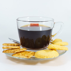 glass cup of black coffee with cookies and biscuits on withe background.