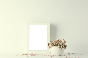 empty picture frame, decorated with small pink flowers