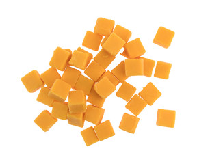 Top view of a group of cubed mild cheddar cheese isolated on a white background.
