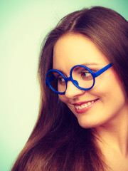 Happy smiling nerdy woman in weird glasses