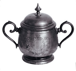 Vintage handmade sugar bowl of silver with oriental ornaments isolated over white