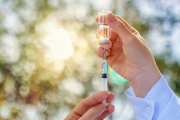 Syringe with medicine in hands .
