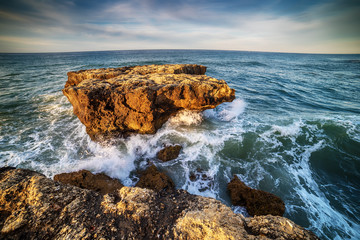 Fototapeta na wymiar Algarve, Portugal: rocks in the coast of Albufeira at sunrise 
