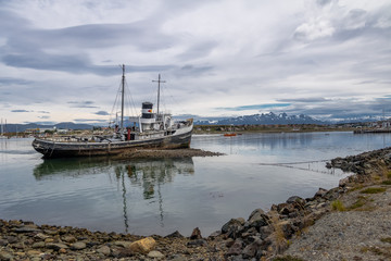 Fototapeta premium Abandoned HMS Justice tug boat grounded in Patagonia - Ushuaia, Tierra del Fuego, Argentina