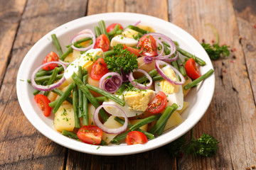 vegetable salad with potato,egg,bean and tomato