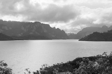 Evening on the coastline of Lake Ratchaprapha next to the dam - black and white