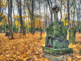 Warsaw, Poland - October 31, 2016: Stone tombs in the Orthodox cemetery in Warsaw, Autumn