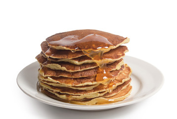 homemade pancakes with maple syrup, closeup toned photo