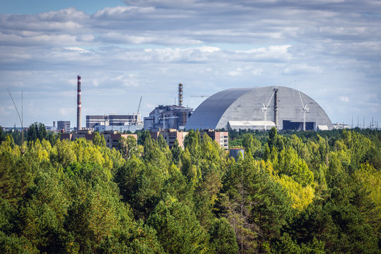 Aerial view of Chernobyl Exclusion Zone, Ukraine. Chernobyl New Safe Confinement on background