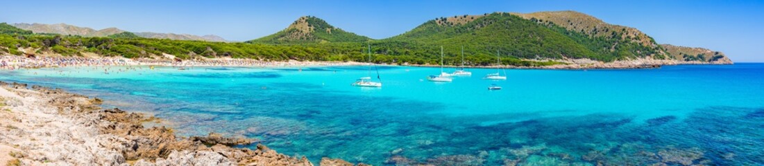 Fototapeta na wymiar Beautiful seascape panorama of beach Cala Agulla on Majorca island Spain