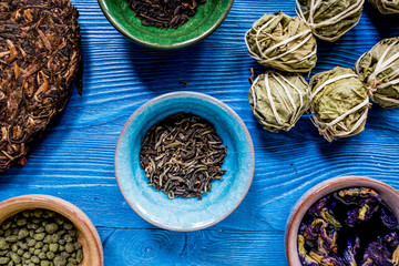Drink herbal tea with brew blue wooden table background top view