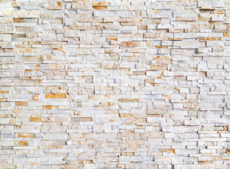 Modern and traditional yellow gold tile stone panel outdoor wall pattern background for retaining wall system exterior and interior design or decoration