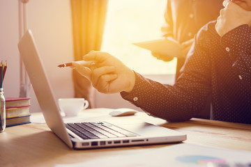 Project managers meeting.Business crew working with new startup,Teamwork concept,man and woman discussion document in the office.collaborative filtering.Analyze plans.selective focus,vintage color