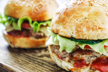 Cloe-up homemade burgers on wooden background