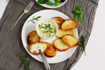 bread toast with garlic cheese sauce on grey background. top view