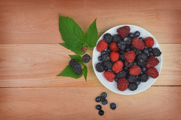 Delicious berries on a plate. Food background.