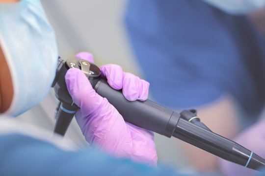 Endoscope In Doctor`s Hand During Medical Procedure.