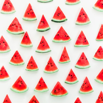 Pattern made of tasty slices watermelon on white background. Flat lay. Top view. Summer pattern