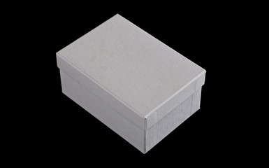 White closed cardboard box with cover isolated on black background