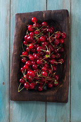 ripe Cherries on wooden table with water drops,fresh summer background