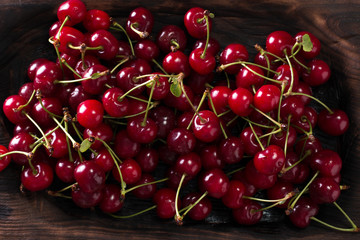 Naklejka na ściany i meble ripe Cherries on wooden table with water drops,fresh summer background