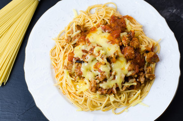 Italian spaghetti bolognese with tomato sauce, meat and cheese