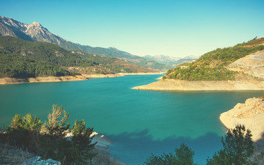 Fototapeta na wymiar Mountain lake in nature park, summer landscape card.