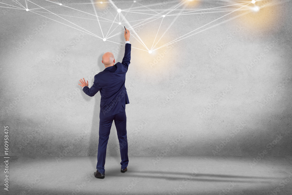Poster businessman in front of a wall with web operating system screen and network connection displayed on 