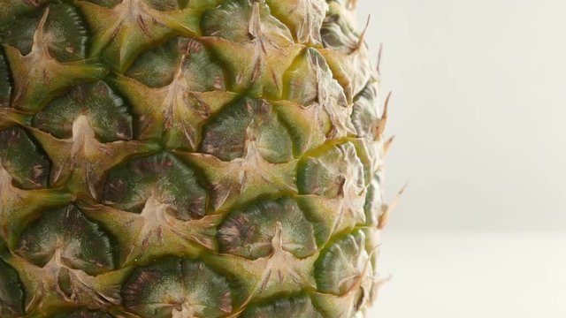 Tropical Ananas comosus structure 4K 2160p 30fps UltraHD tilting footage - Close-up of exotic pineapple fruit texture slow tilt 4K 3840X2160 UHD video