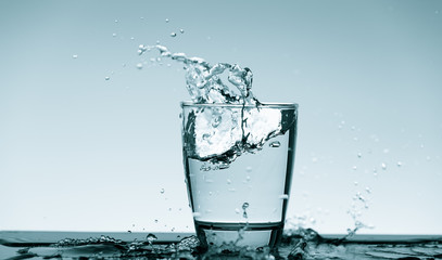Water splash in glass. Drinking water concept