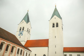 A view of the belfry of romanesque basilica Saint Mary and Corbinian Cathedral in Freising, Germany.