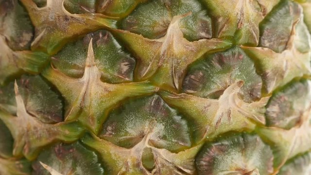 Pineapple exotic fruit texture close-up 4K 2160p 30fps UltraHD tilting footage - Tropical Ananas comosus structure slow tilt 4K 3840X2160 UHD video