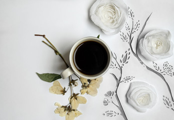 Coffee with paper and pressed flowers