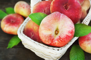 Basket of fresh ripe sweet peaches