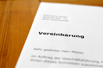 Obraz premium A letter on a wooden table - Agreement
