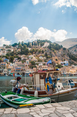 Symi, Greece - September 03, 2015: Wonderful Greece. Island Symi, with a turquoise sea, the yachts in the harbor and colorful houses on the slopes of the island