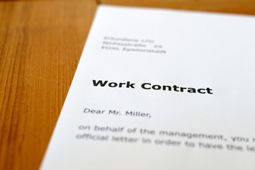 Obraz premium A letter on a wooden table - employment agreement