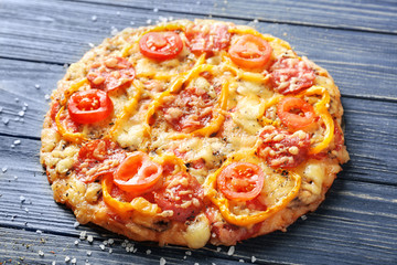 Tasty Italian pizza on wooden table