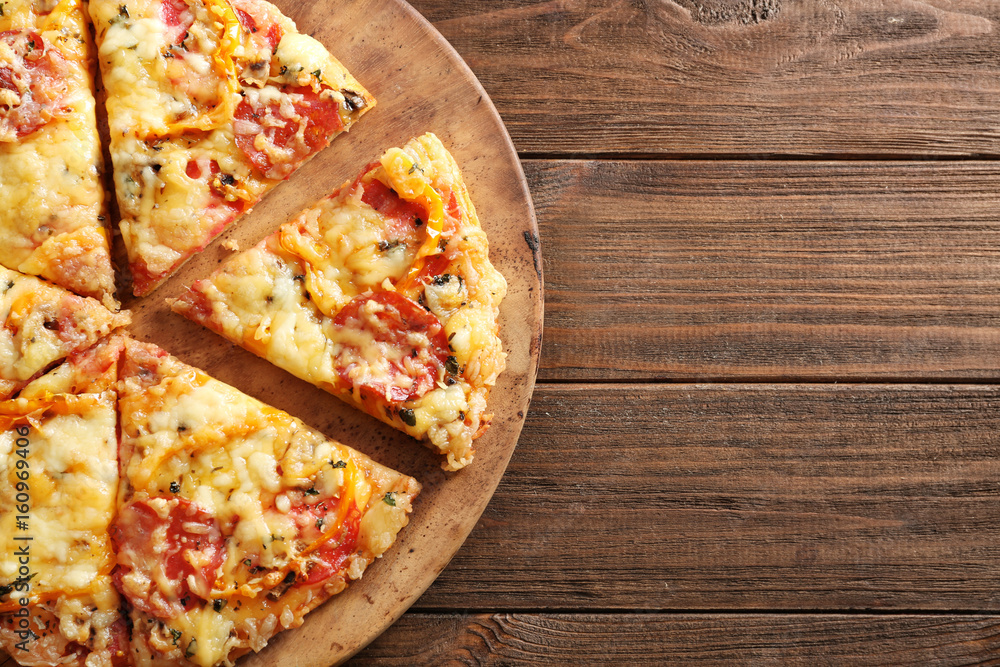 Sticker Plate with tasty pizza on wooden table, close up view