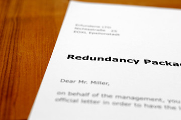 Obraz premium A letter on a wooden table - redundancy package