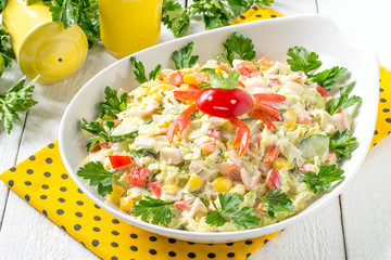Fresh vegetable salad with chinese cabbage and surimi