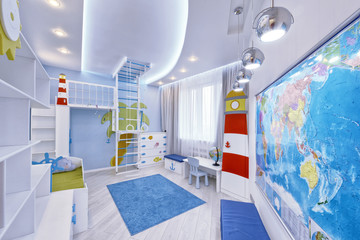 The interior of a children's bedroom for a boy in a marine style.