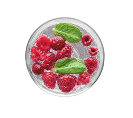 Tasty refreshing lemonade with berries in glass on white background